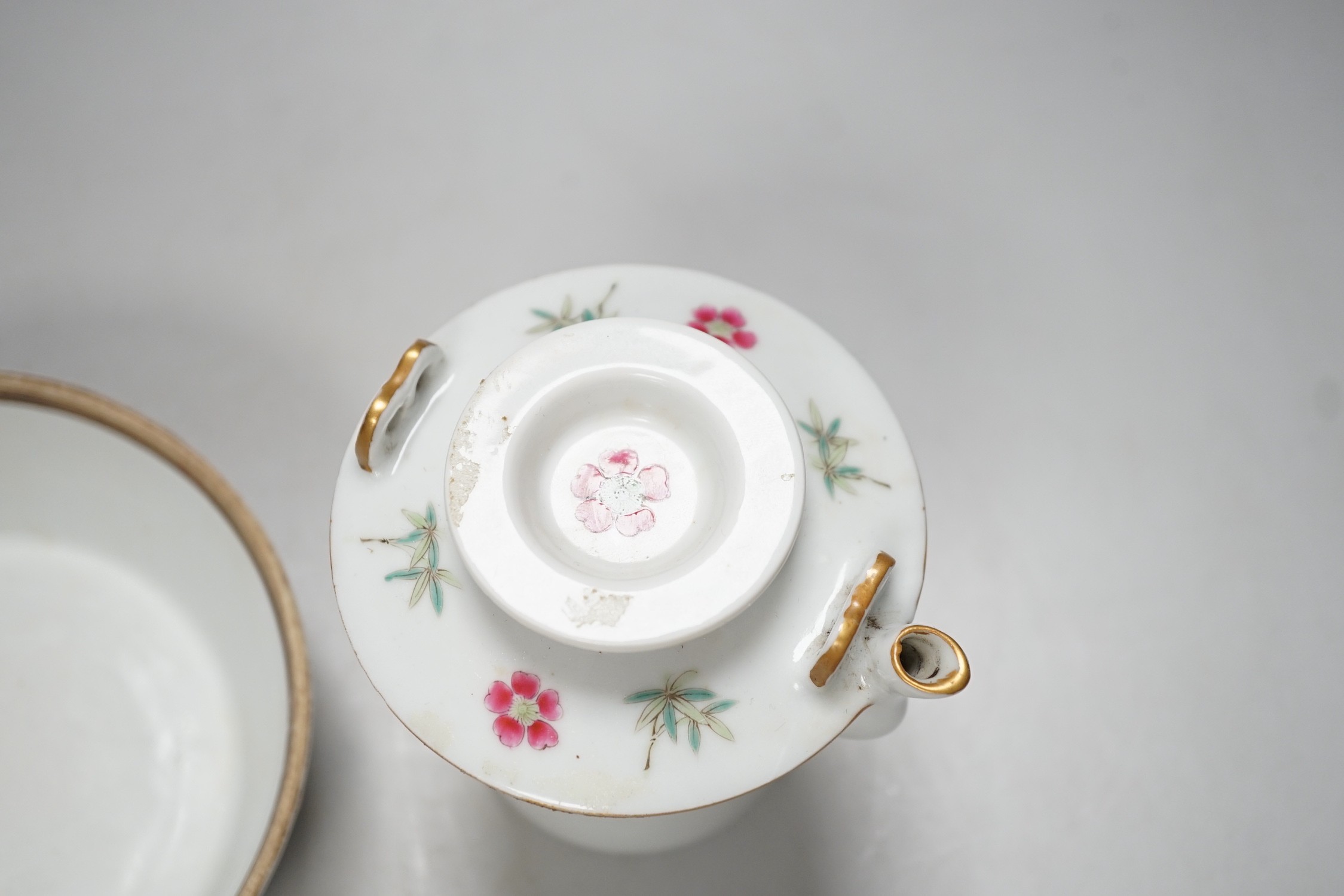 A Chinese famille rose teapot and a cover, together with a similar dish. 12cm tall
